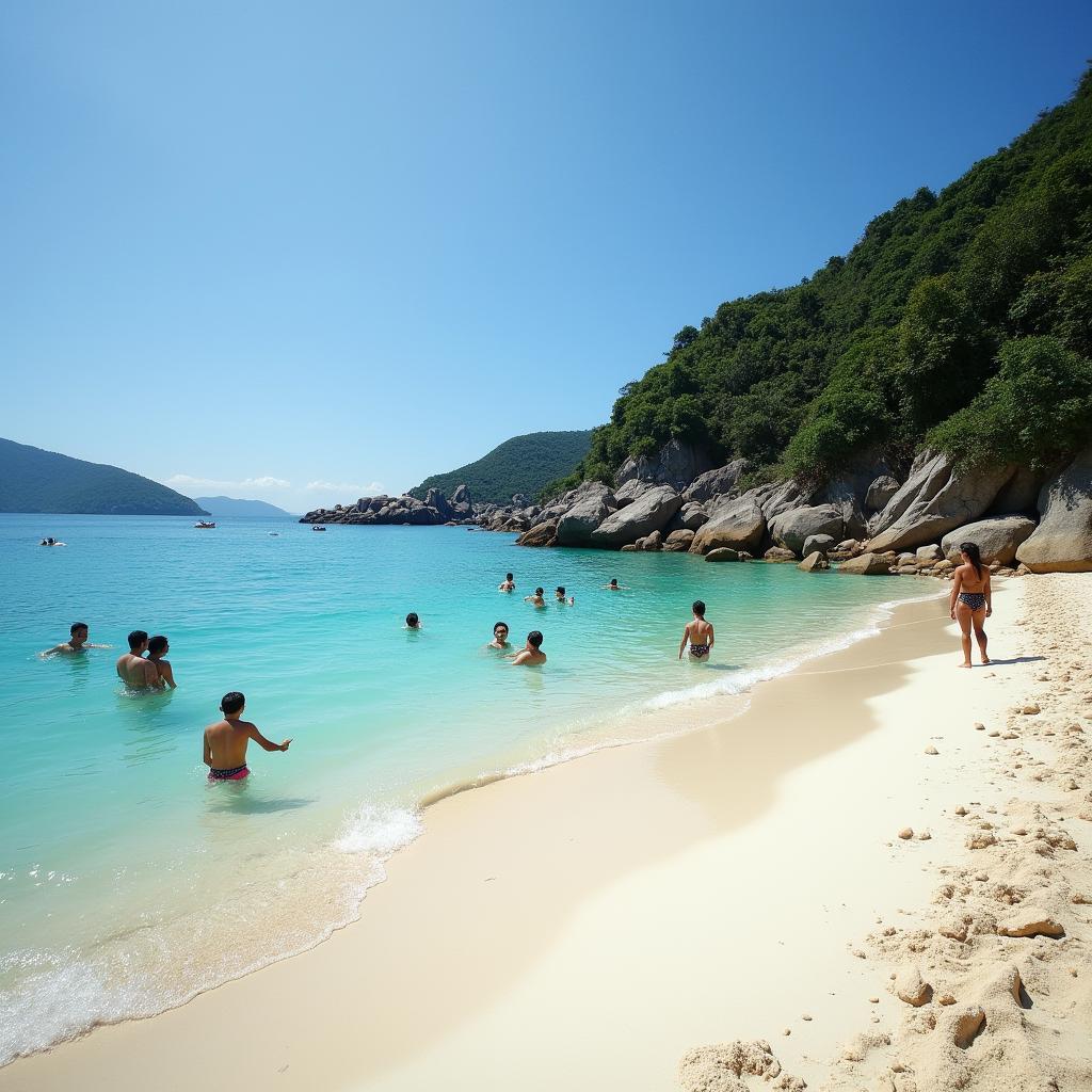 Bãi Cát Tiên ở Hòn Ba Trái Đào với cát trắng mịn và làn nước biển trong xanh, du khách đang tắm biển